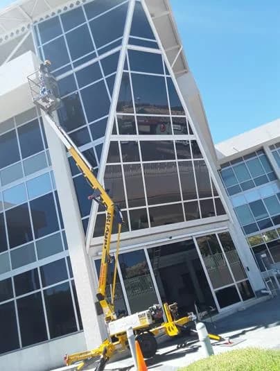 High Rise Cleaners at boom lift glass building